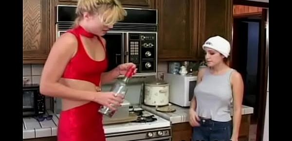  Lesbian dildo fucking in the kitchen